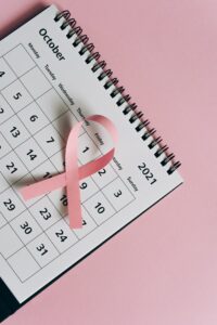 Breast Ca cer Awareness Month calendar and pink ribbon