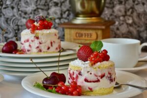 strawberry shortcakes with berries and cherries and coffee