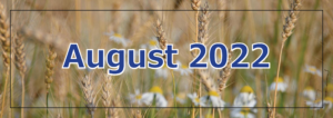 August 2022 banner with wheat background