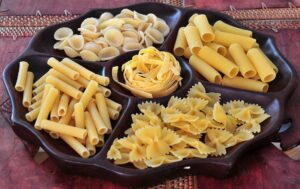 Various type os pasta displayed on a serving tray.