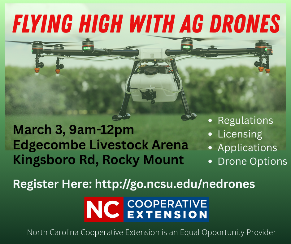 a drone in flight over a grassy field